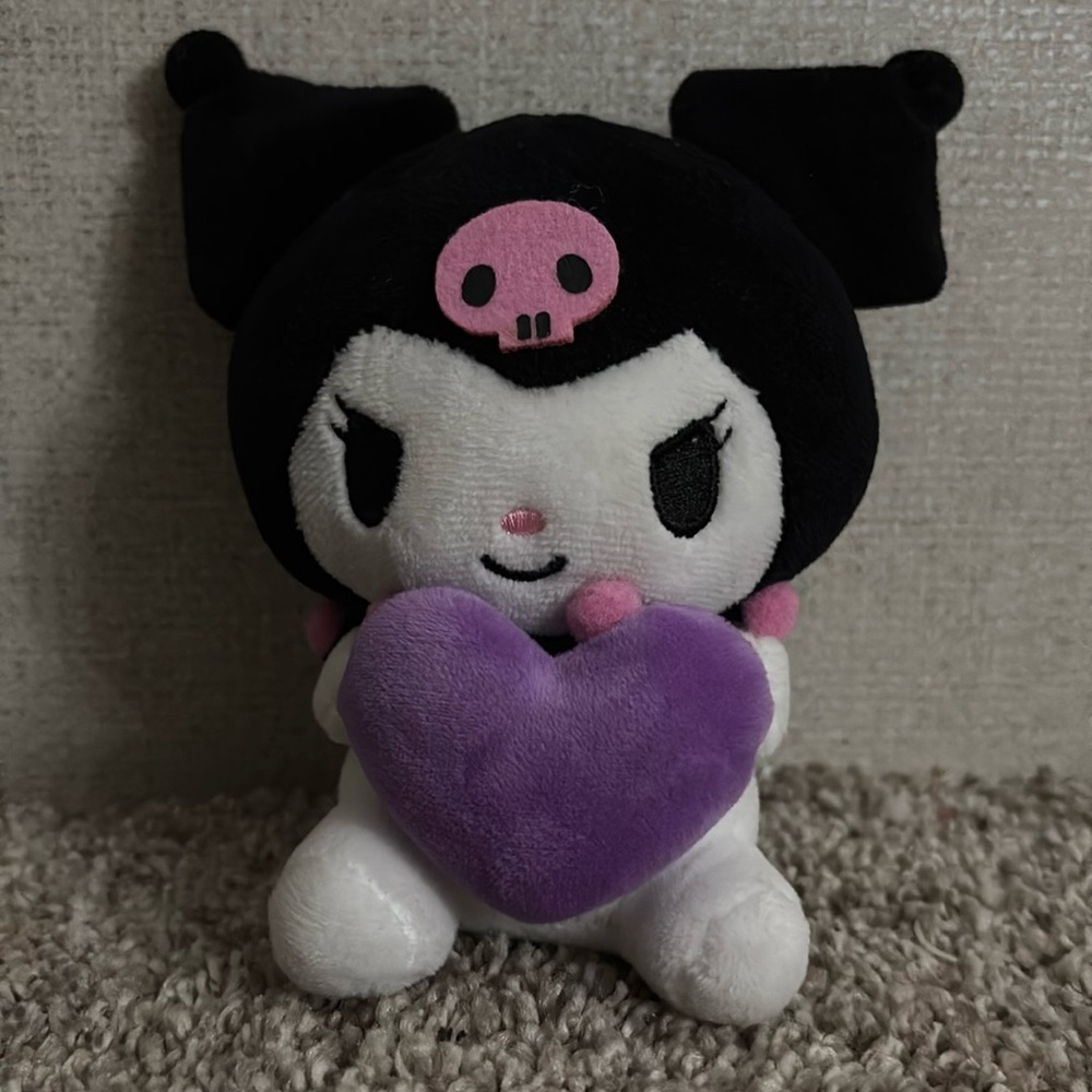 Sanrio Kuromi Black, pink, purple and white stuffed animal keychain.